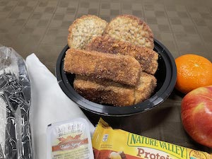 French Toast with Syrup with 2 Sausage Patties, Small Apple & Orange with Nutri Grain Bar