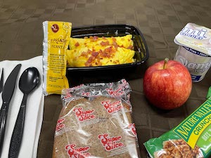 Bacon & Cheddar Omelet with Yogurt & Granola Bar, Gala Apple, Banana Bread & Hot Sauce pack