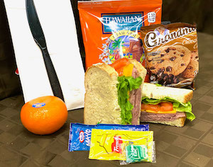 Roast Beef & Cheddar Sandwich on Sourdough Bread, Hawaiian BBQ Chips & Chocolate Chip Cookie. Comes with 1 Bottled Water. 